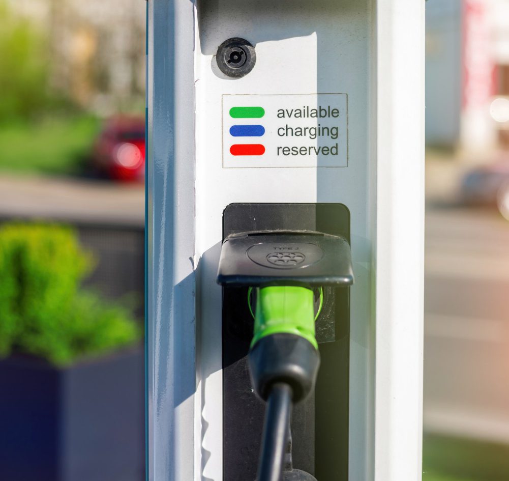 A close up of the charging port on an electric car.
